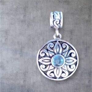 Vintage Round Silver Pendant with a Light Blue Gem